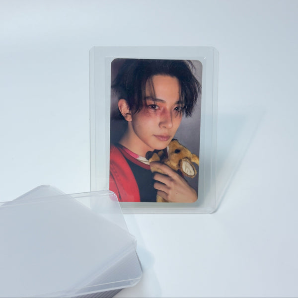 Heeseeung photocard holding a deer plush in a toploader